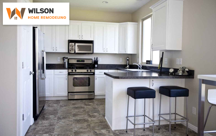 Modern kitchen showcasing a counter extension with additional workspace and under-counter storage options.